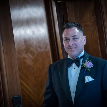 a groom just before he goes into his wedding ceremony in old marylebone town hall