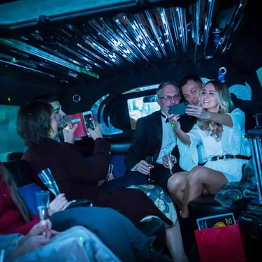 wedding party in the back of a limousine