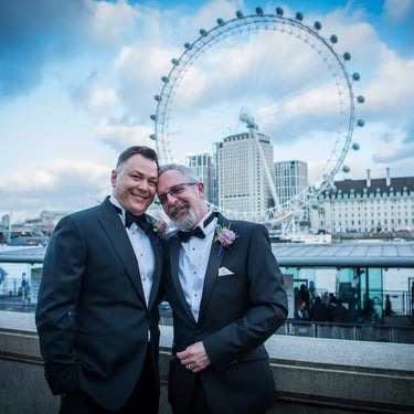 newly-weds standing in front of the london eye