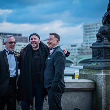 newly-wed saying hello to a busker on london's southbank