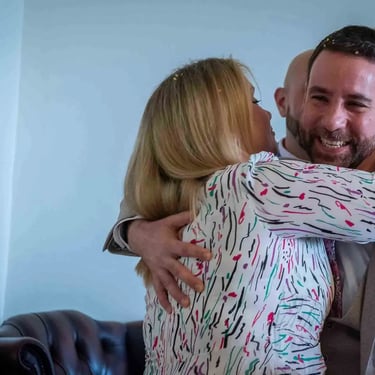 guest hugging a groom