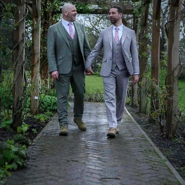 two grooms walking around the grounds of Pembroke Lodge Richmond