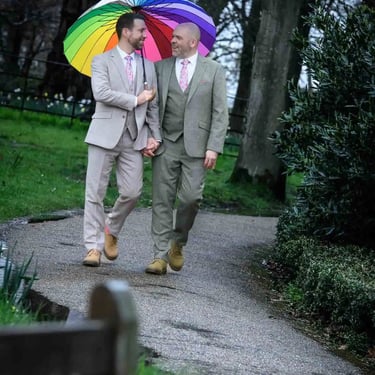 two grooms walking around the grounds of Pembroke Lodge Richmond