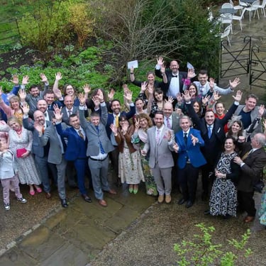 the entire wedding party in the grounds of Pembroke Lodge Richmond