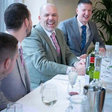 groom laughing with his best man