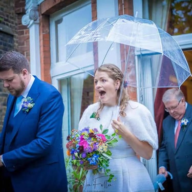 Newly weds walking in the garden of Southwark Registry Office