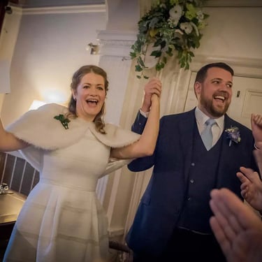 Newly weds cheering inside Southwark Registry Office