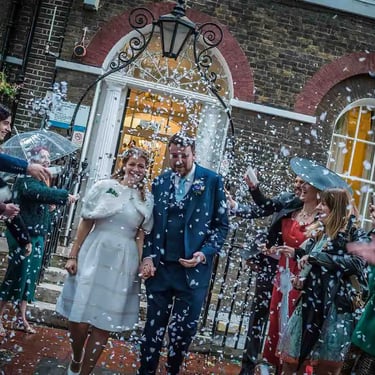 Newly weds walking through confetti at Southwark Registry Office