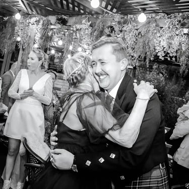 wedding guests hugging each other at the Rushmere Wimbledon