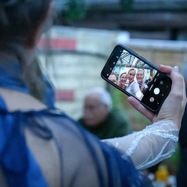 guests taking a selfie with the bride