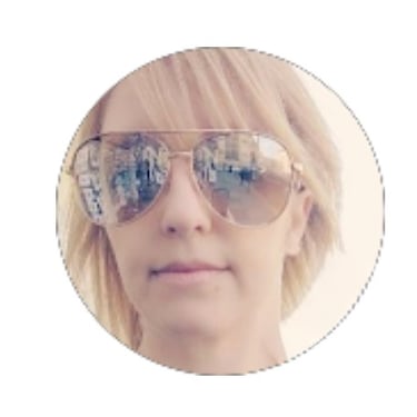 Blonde woman wearing gold-rimmed aviator sunglasses in a circular profile portrait.