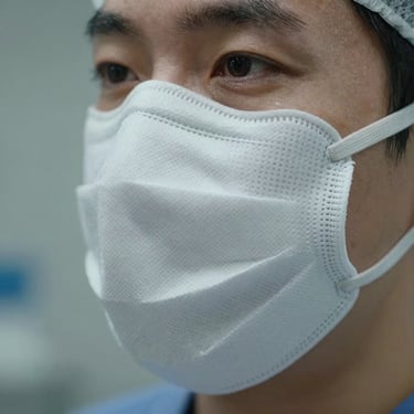Macro shot of a high-performance UV protection mask fabric, sterile clinical lighting.