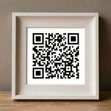 A clean, high-contrast QR code graphic framed elegantly on a textured paper background, designed for easy mobile scanning.