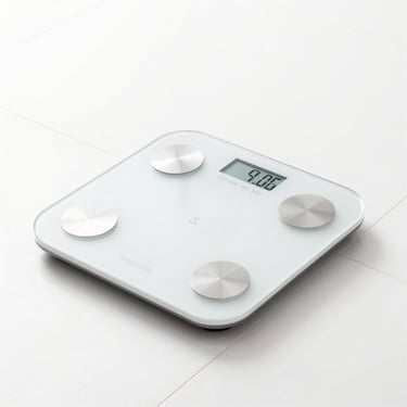 Smart scale displaying digital metrics on a clean bathroom tile floor, bright high-key lighting, modern retail aesthetic