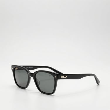 Luxury designer sunglasses on a clean white surface, bright studio light, modern retail aesthetic