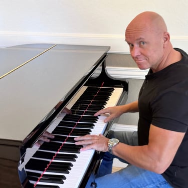 Mark Bulmer Performing On Piano