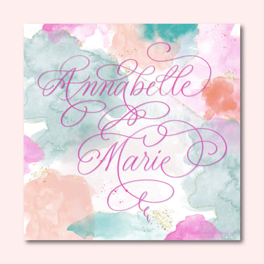 Hand-drawn digital calligraphy of Annabelle Maria in pink flourished text on multi-color pastel watercolor background.