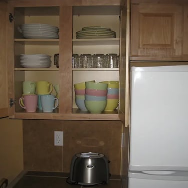 Fully furnished kitchen plateware, dishes, and dining essentials provided for residents at Agate House near BSU.