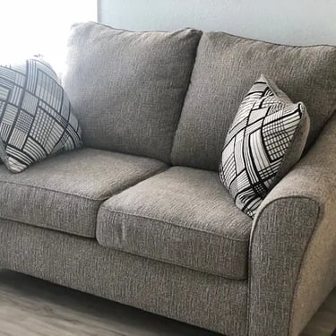 Comfortable living room sofa and seating area for residents at Agate Student House near Boise State.