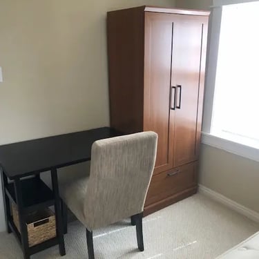 Fully furnished private student bedroom with a bed and workspace at Agate House near Boise State University.