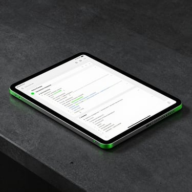 A sleek modern Android tablet lying on a dark concrete desk, showing clean Material Design code structures and responsive UI panels, neon green edge highlights, sharp focus