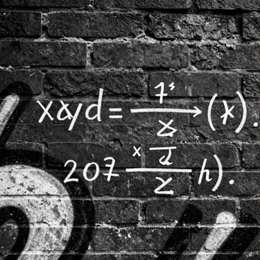 Close-up of mathematical equations scribbled in white chalk over a dark brick wall with faded black-and-white graffiti, high-contrast, gritty texture.