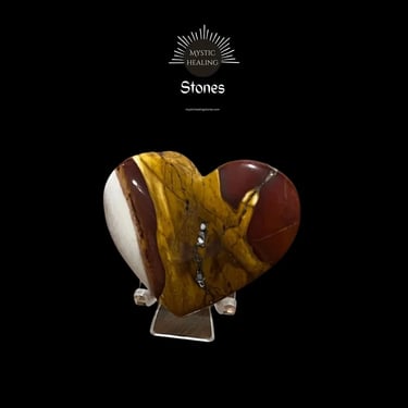 Polished heart-shaped Mookaite Jasper crystal featuring earthy red, yellow, and white patterns on a stand.