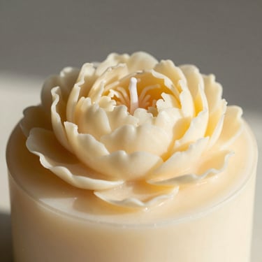 Macro close-up of a wax peony bouquet candle, cream soy wax, soft afternoon shadows.