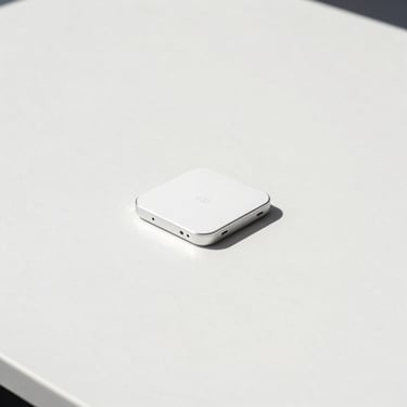 Minimalist studio shot of high-end consumer electronics on a clean slate surface, bright natural daylight, sharp focus