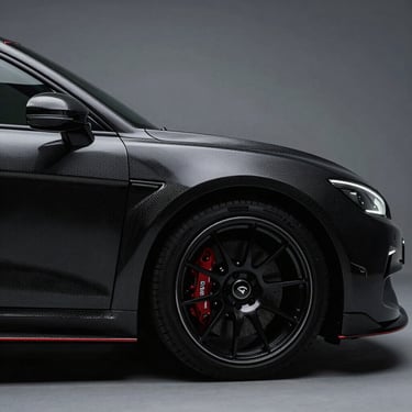 Low-key silhouette of a luxury performance vehicle, dramatic studio lighting highlighting the carbon fiber contours.