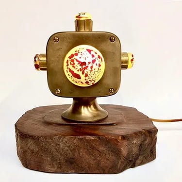 Custom light made from brass boat guidance body and blown glass.