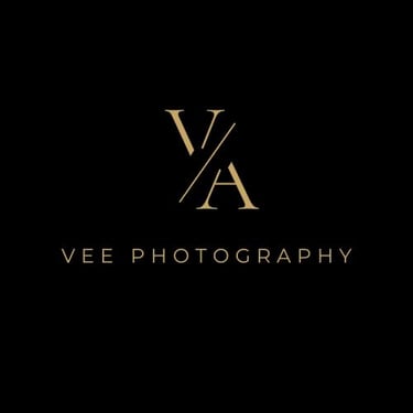Elegant gold Vee Photography logo with a VA monogram on a black background.