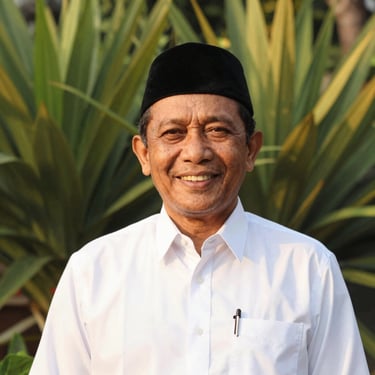 Portrait of a respected Indonesian Muslim community leader in a clean white shirt and peci, smiling warmly, natural soft lighting