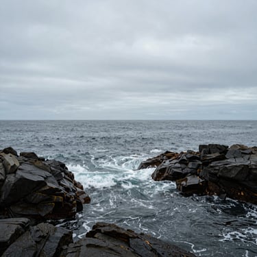 A quiet ocean cove in Galicia under an overcast sky, gentle waves kissing dark rocks, wide empty horizon, square crop