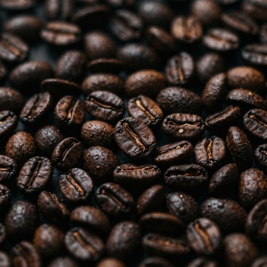 Sumatran Mandailing coffee beans, earthy texture, rich dark roast, low-key lighting.