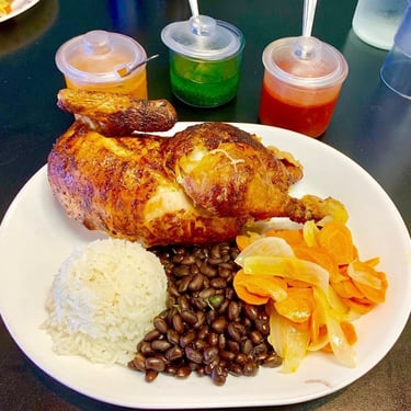 Las Brasas restaurant roast chicken dinner with flavorful sauces