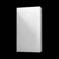 White Tesla Powerwall home battery system for solar energy storage isolated on a black background.
