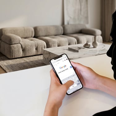 Person looking for designer on phone