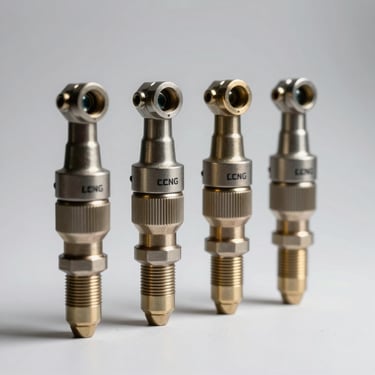 Close macro of four CNG/LPG injectors arranged in a row on a white surface under studio strobes, nozzle tips and body markings visible, plain background