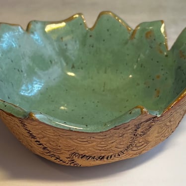 Ceramic bowl with green inside glaze and iron oxide outside