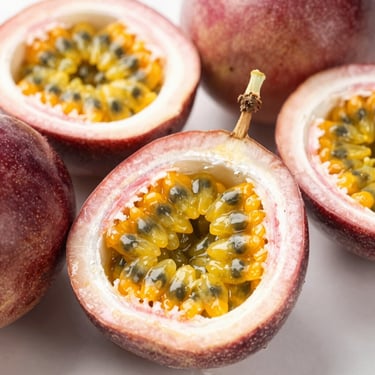 Macro shot of opened fresh passion fruits showing seeds and golden pulp, bright natural light, crisp details.