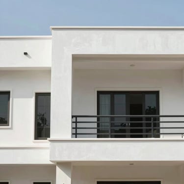 Exterior facade of a modern home with newly applied, weather-resistant paint, clean architectural lines, bright daylight, Ahmedabad.