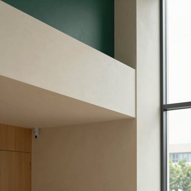 Structured architectural detail of a modern rehabilitation clinic, clean lines, warm slate and cream tones