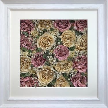 a flower wall style preserved wedding bouquet full of gorgeous roses in a frame