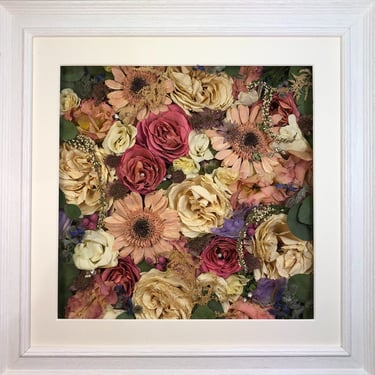 a flower wall style preserved wedding bouquet with soft pink gerberra flowers in a frame