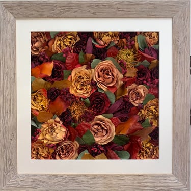 a flower wall style preserved wedding bouquet of autumnal colours in a frame