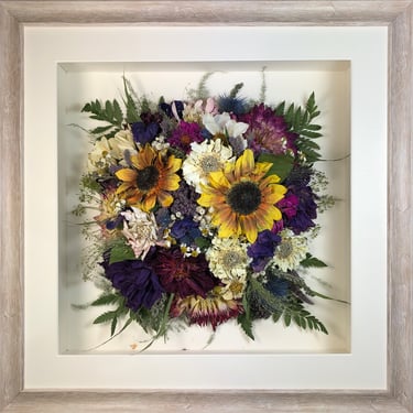 Birdseye view preserved wedding bouquet in a frame with amazing sunflowers