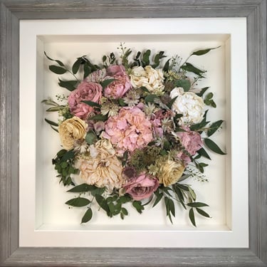 Birdseye view preserved wedding bouquet of pink peonies in a frame
