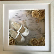 a photo of a standard size memory box with preserved flowers and keepsakes from a wedding day