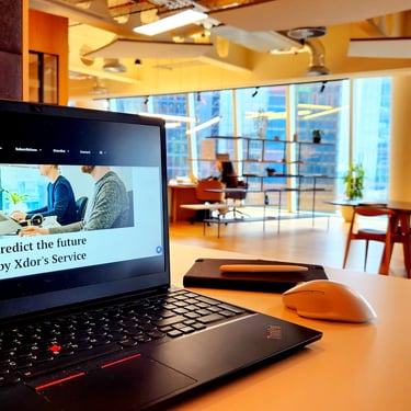 Xdor Digital Marketing Agency Office shown PC with Xdor Corporate Webpage in Workspace Area in the office